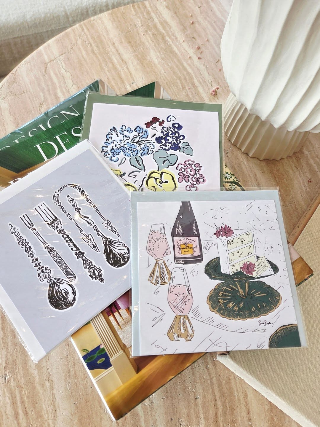 Illustrated cards on a marble table